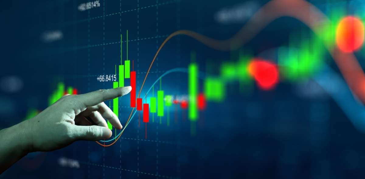 Persons finger touching a symbol stock graph and chart, understand your market concept