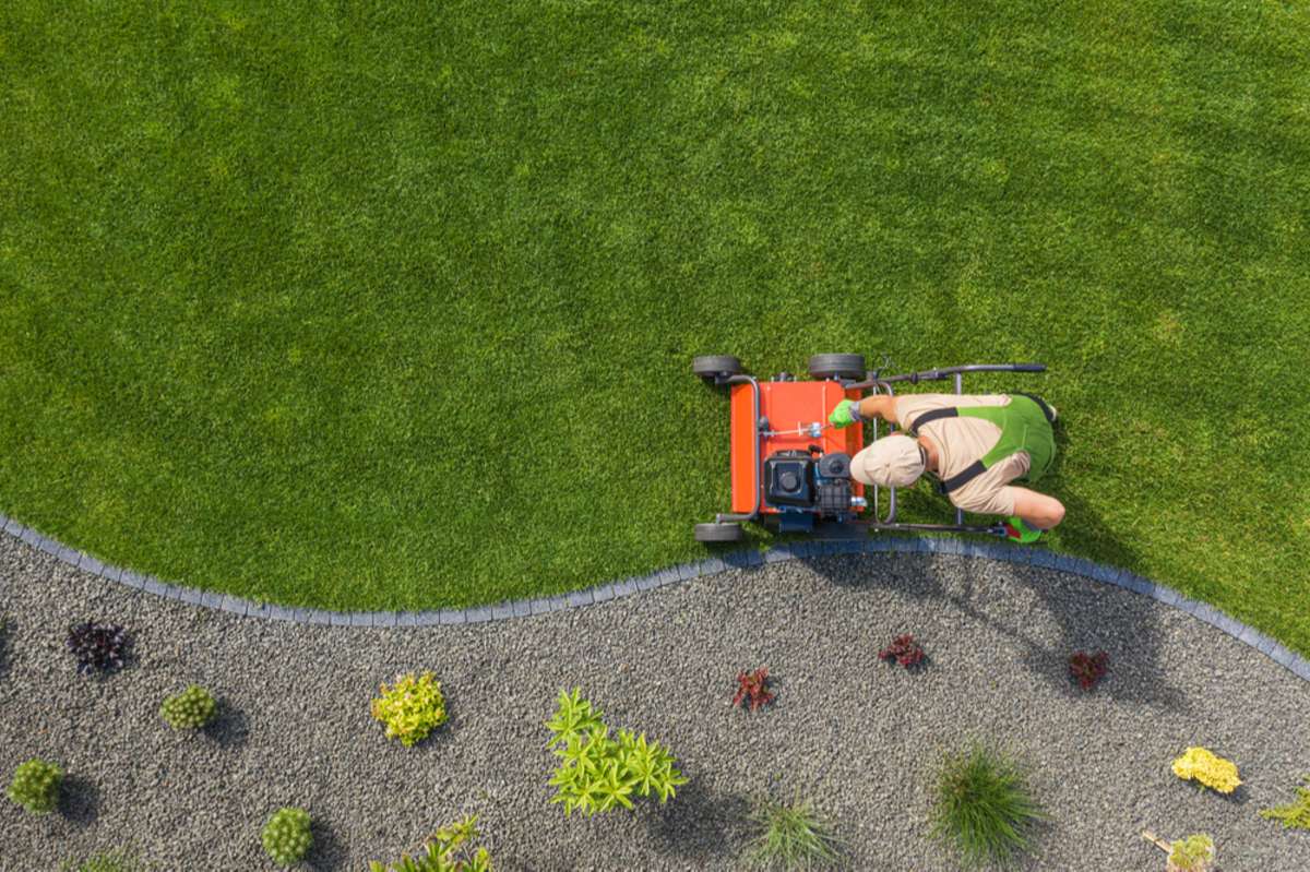 A man mowing the lawn, landscaping concept