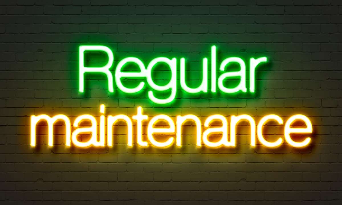 Light up letters on the wall that read regular maintenance